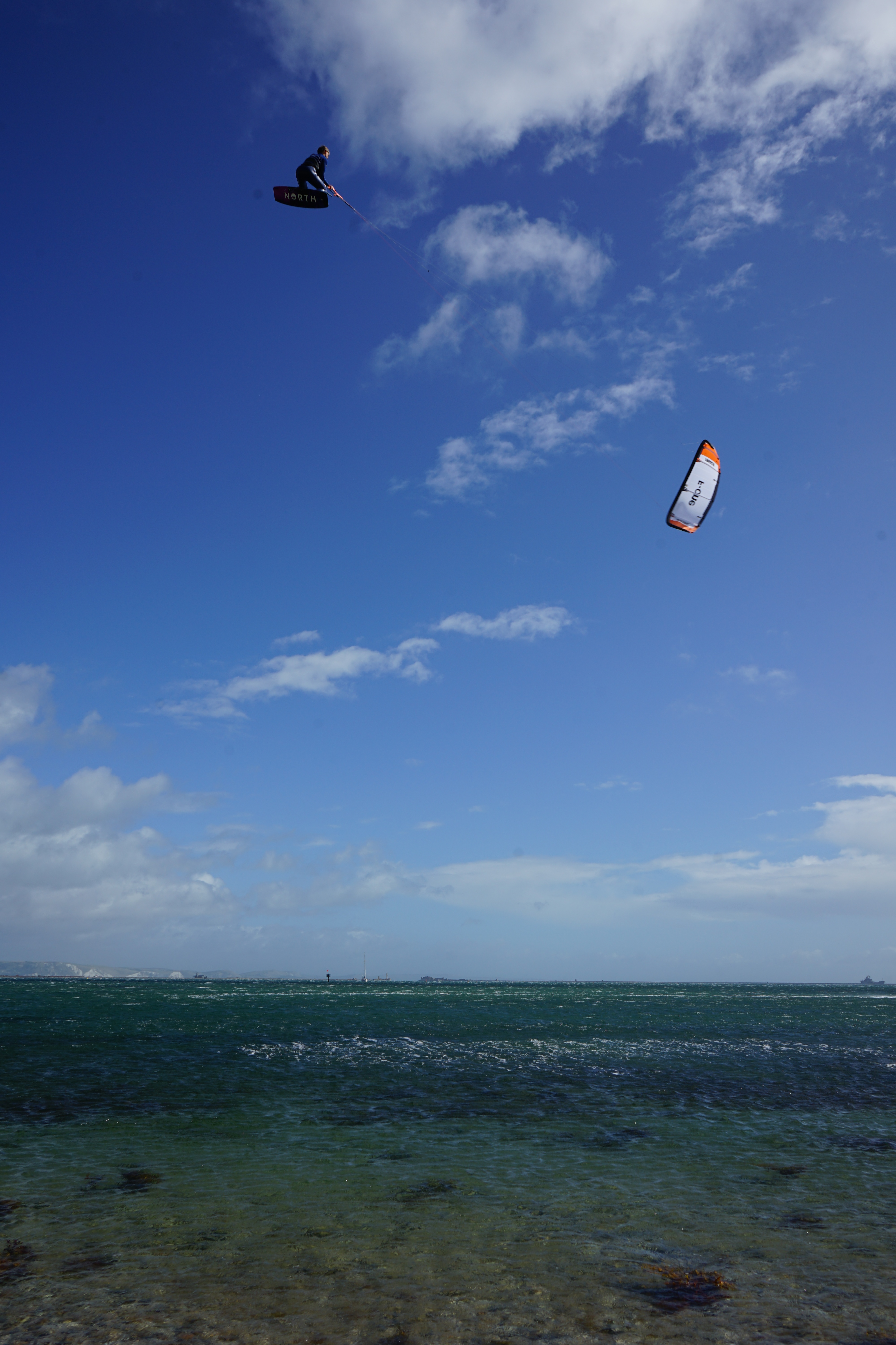 Kiteboarder big air jump, Portland Harbour